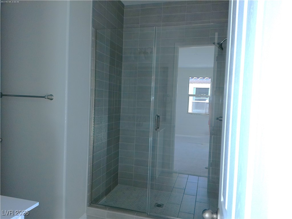 6607 Dove Point Place Las Vegas, NV 89130 - Photo 7 of 14 Bathroom with a shower stall