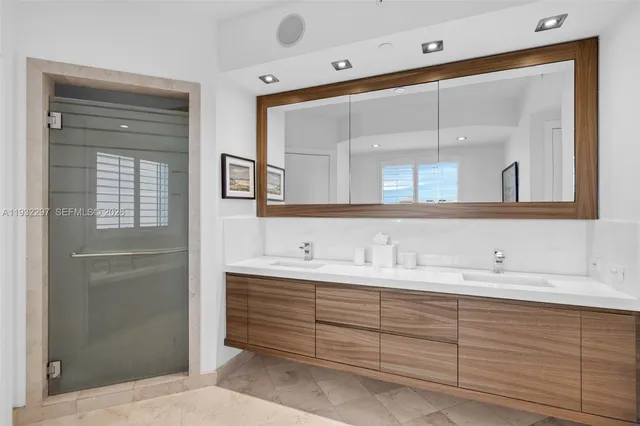 a bathroom with a tub sink and mirror