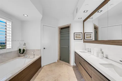 a bath tub sitting next to a window