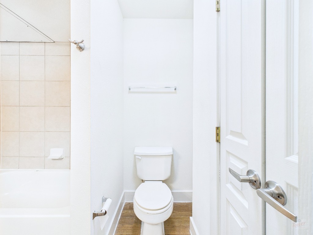 711 West 32nd Street, Unit 126 Austin, TX 78705 - Photo 12 of 15 a white toilet sitting next to a white sink