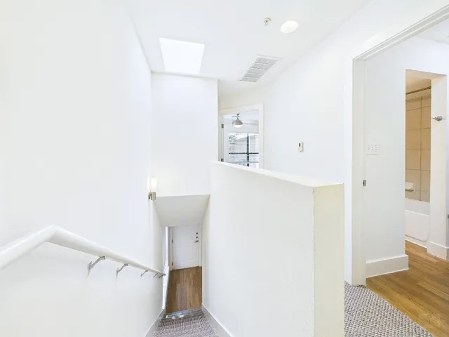 a view of a hallway with workspace