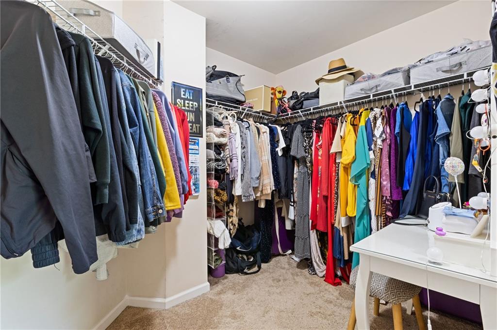 2352 Alexander Top Place Grayson, GA 30017 - Photo 46 of 66 a view of walk in closet with clothes
