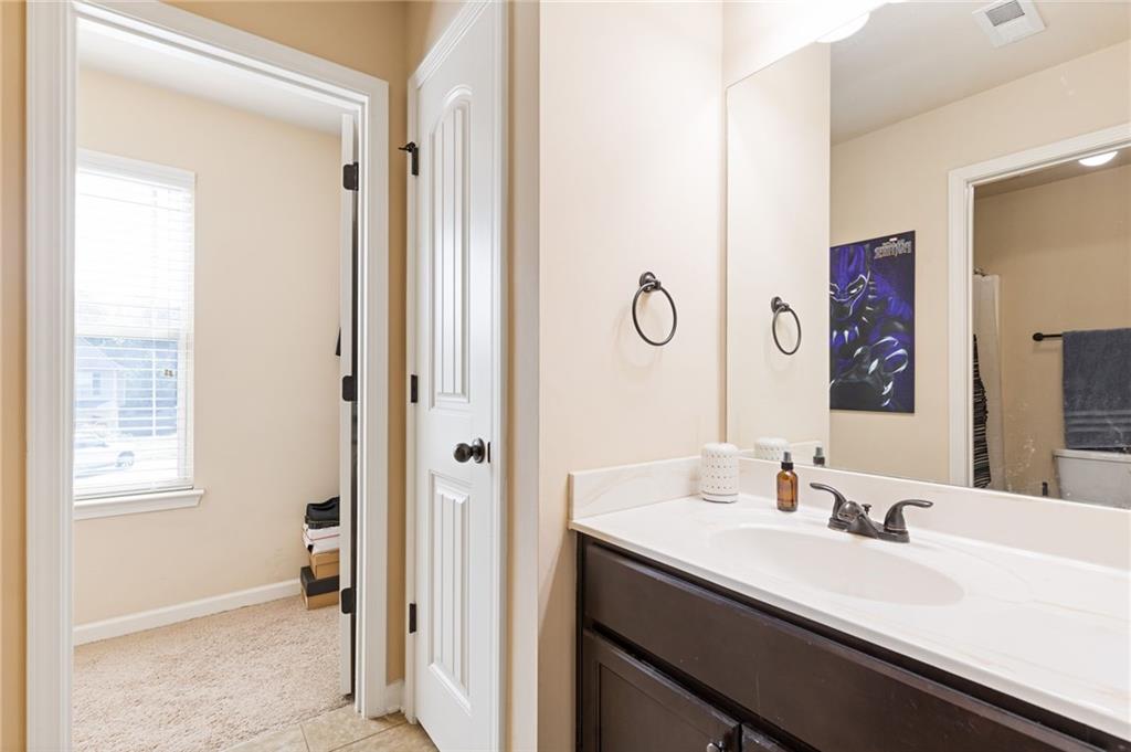 2352 Alexander Top Place Grayson, GA 30017 - Photo 50 of 66 a bathroom with a sink and a mirror