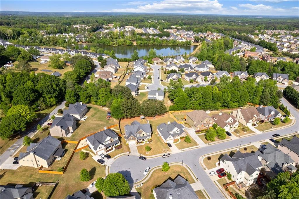 2352 Alexander Top Place Grayson, GA 30017 - Photo 65 of 66 an aerial view of a city with lots of residential buildings and mountain view in back