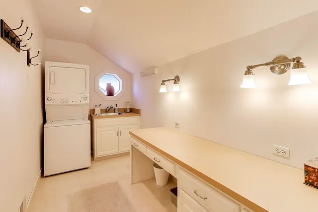 a kitchen with a sink cabinets and appliances
