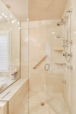a bathroom with a shower and a tub