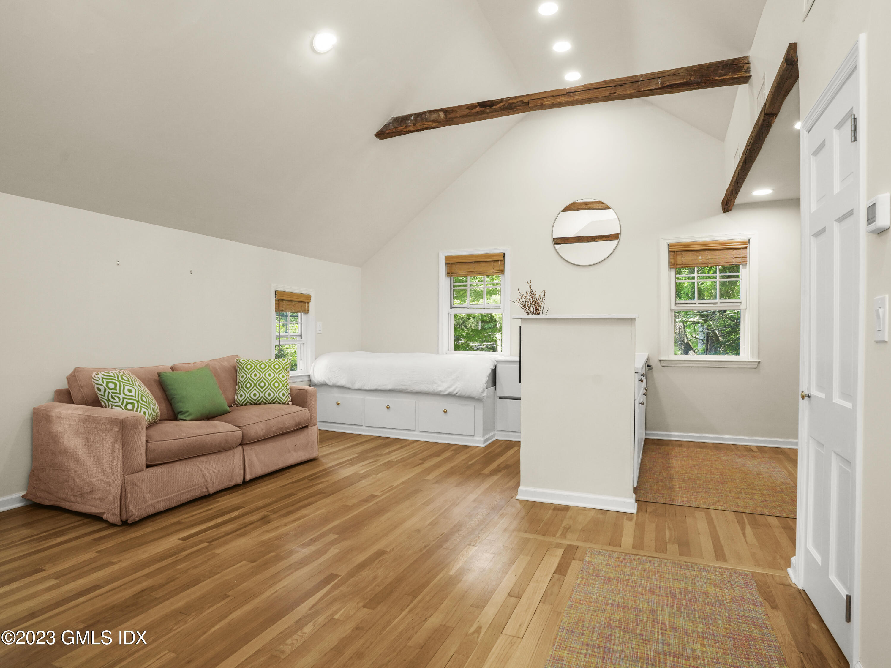 470 June Road, Unit STUDIO Stamford, CT 06903 - Photo 2 of 11 a living room with furniture and a window