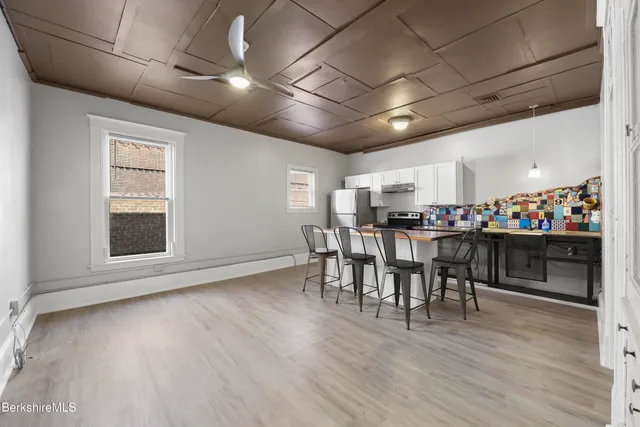 a kitchen with stainless steel appliances granite countertop a sink and stove