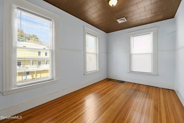 a view of a livingroom with furniture and a window