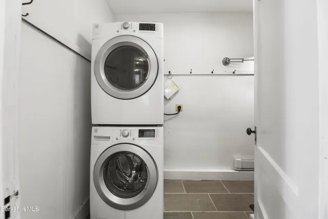 a workspace with wooden floors and wooden cabinets