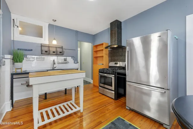 a bathroom with a sink a vanity and a mirror