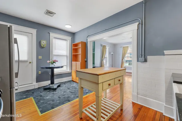 an empty room with a empty space and windows