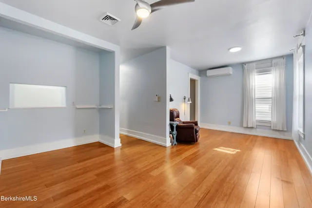 a white toilet sitting next to a bathroom sink