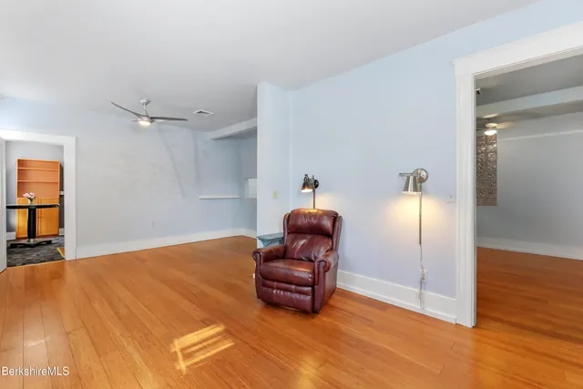 a view of a room with lots of wooden floor
