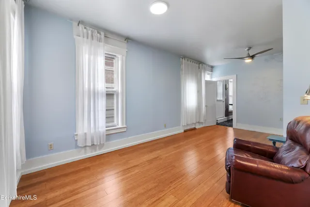 a view interior of a house wooden floor and an entryway
