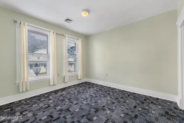 a view of a room with lots of wooden floor