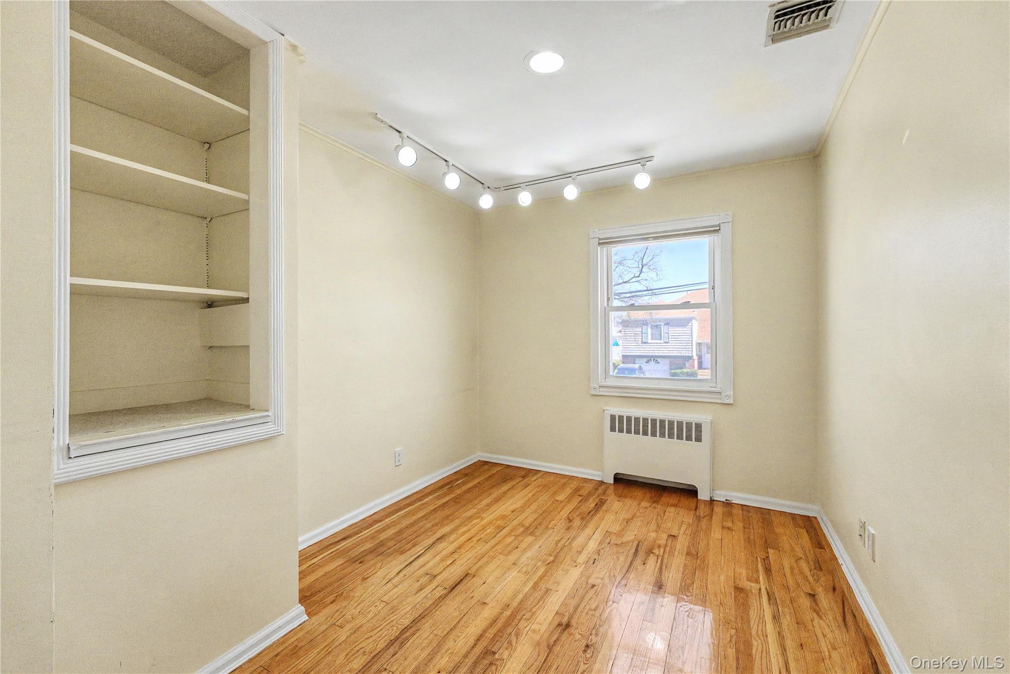 567 Oxford Road Cedarhurst, NY 11516 - Photo 17 of 31 a view of empty room with wooden floor