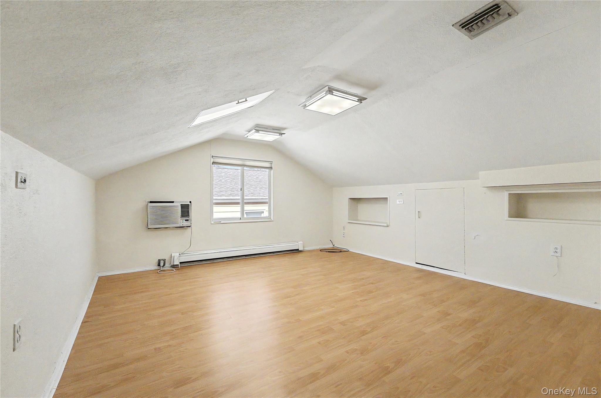 567 Oxford Road Cedarhurst, NY 11516 - Photo 21 of 31 an empty room with a empty space and windows