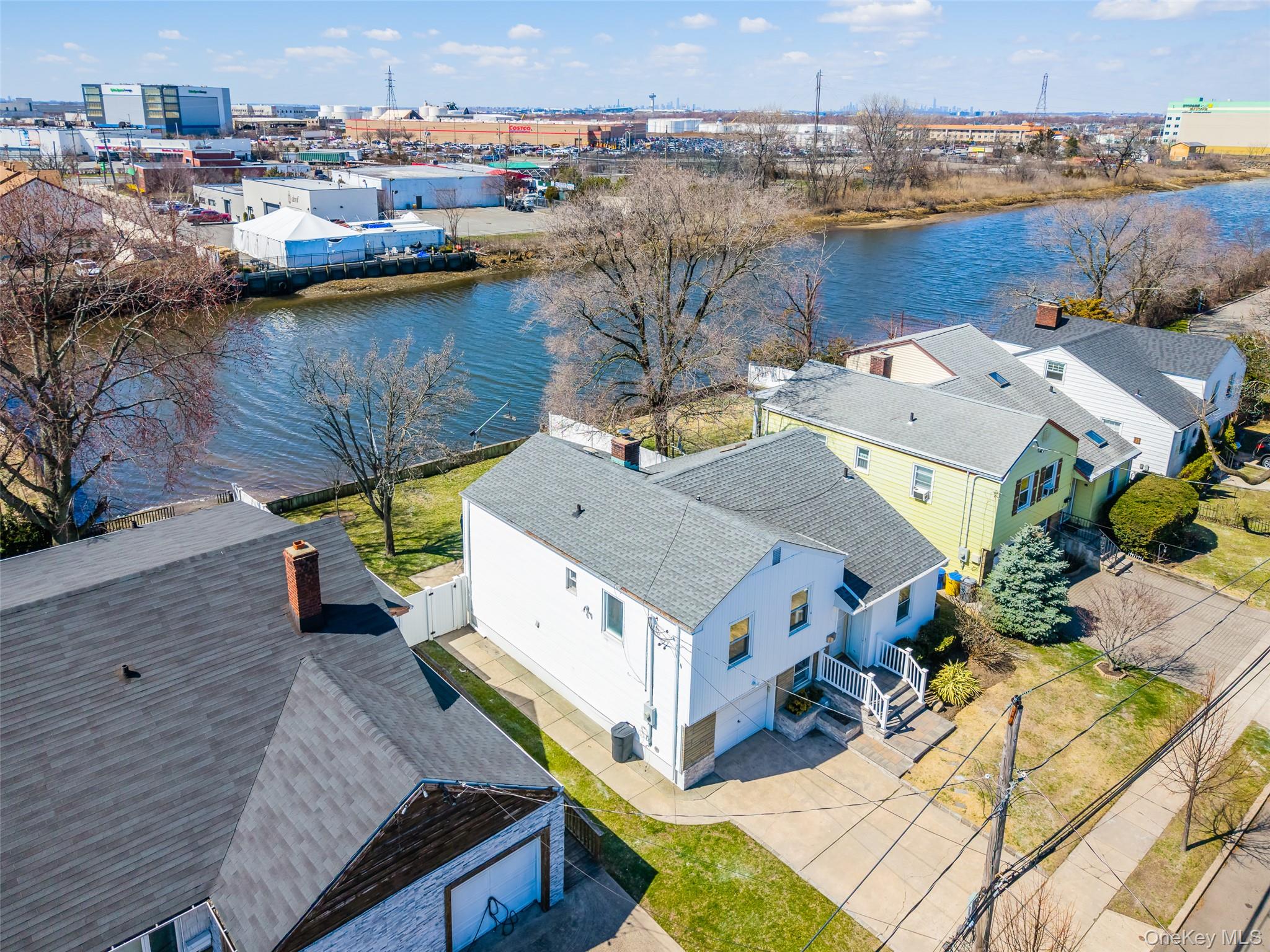 567 Oxford Road Cedarhurst, NY 11516 - Photo 27 of 31 an aerial view of a house with a lake view