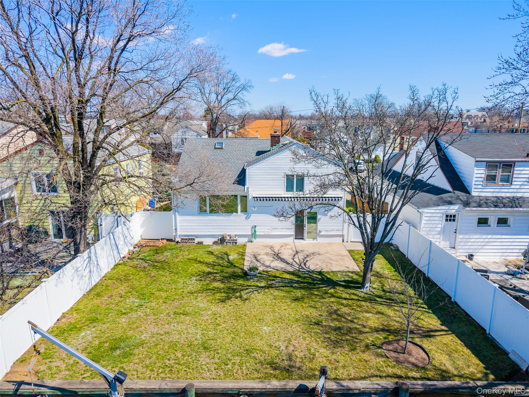 567 Oxford Road Cedarhurst, NY 11516 - Photo 28 of 31 a view of a house with snow on the ground