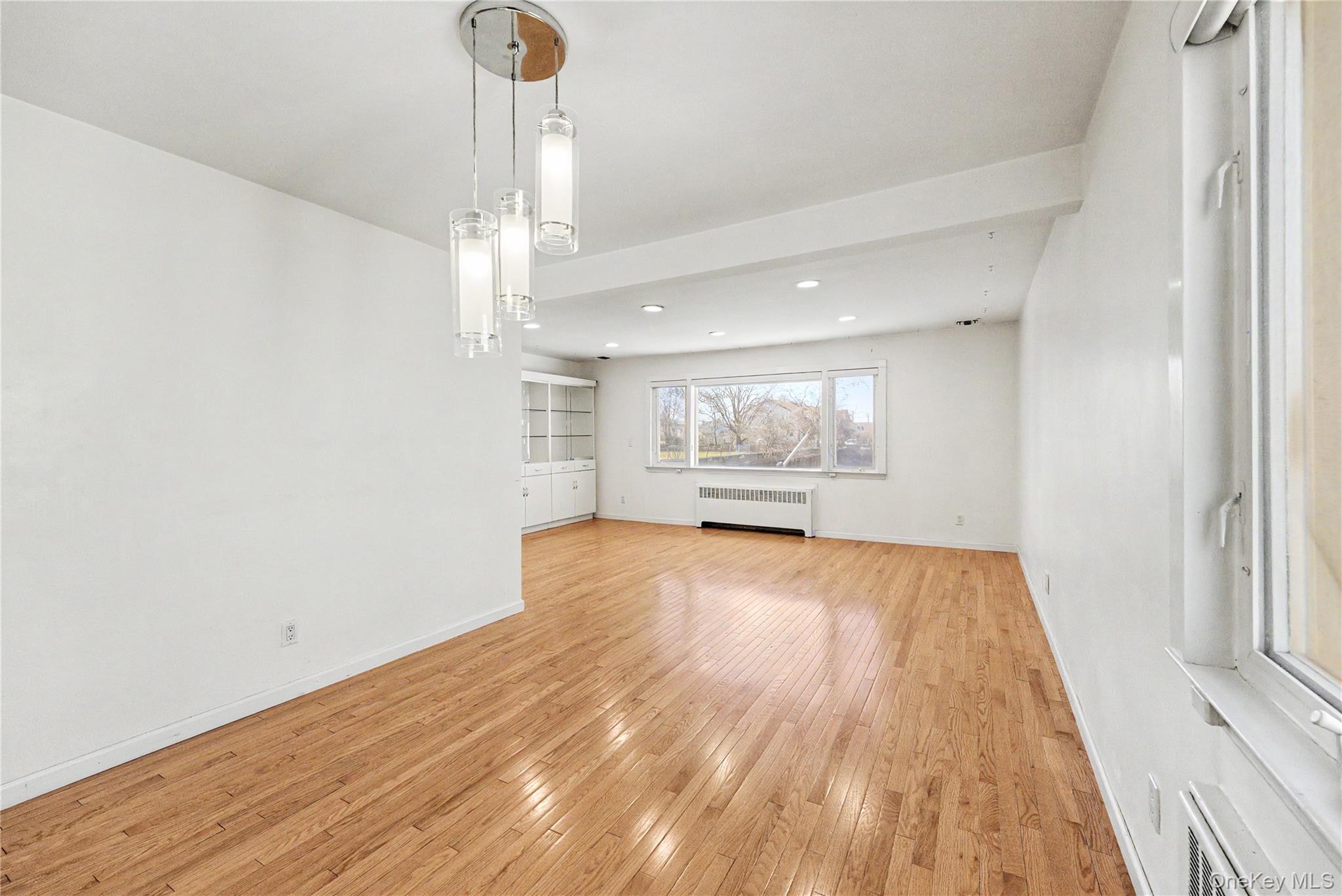 567 Oxford Road Cedarhurst, NY 11516 - Photo 6 of 31 a view of kitchen and hall with wooden floor
