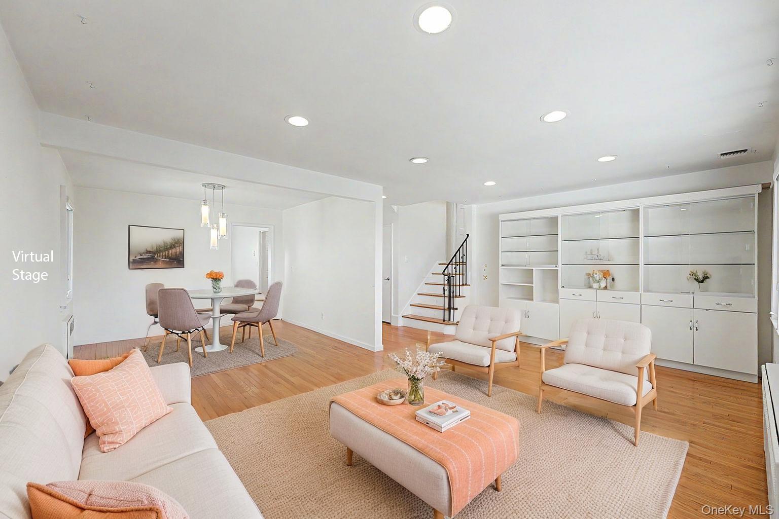 567 Oxford Road Cedarhurst, NY 11516 - Photo 7 of 31 a living room with furniture and a large window