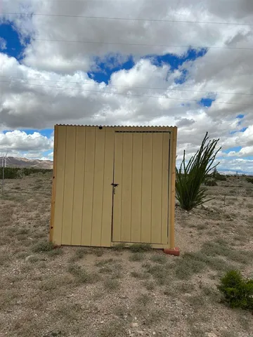 a room with a sink and a microwave