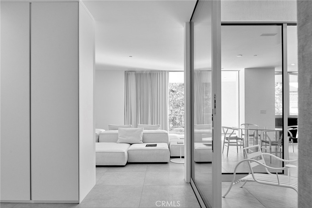 838 North Kings Road, Unit 204 West Hollywood, CA 90069 - Photo 1 of 1 a bedroom with furniture and a gate
