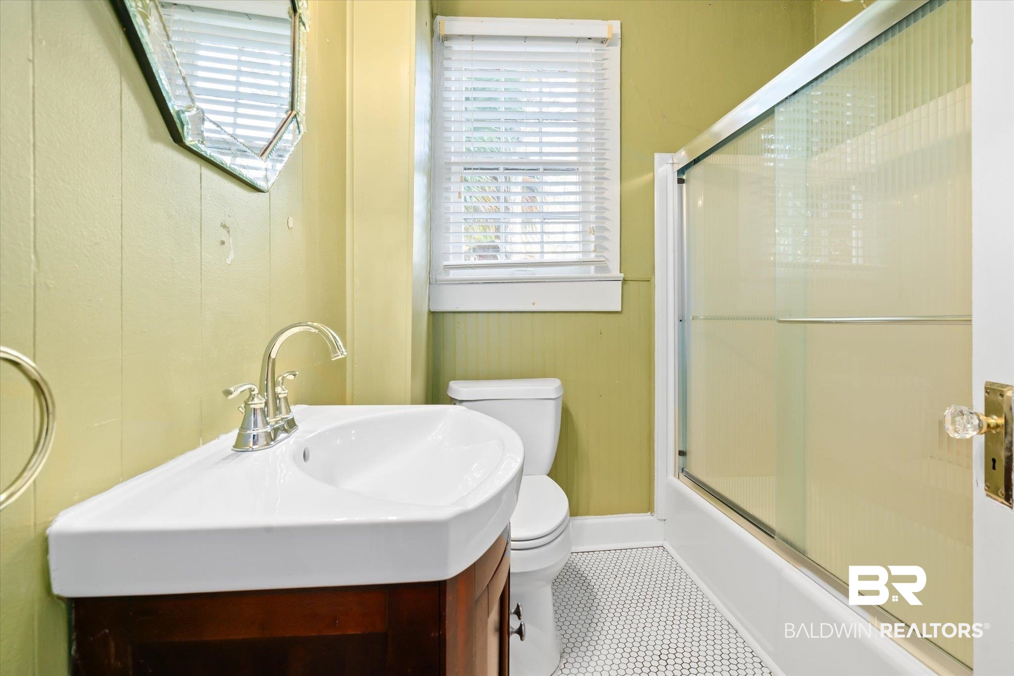 1220 Elmira Street Mobile, AL 36604 - Photo 10 of 20 Full bathroom featuring sink, tile patterned flooring, bath / shower combo with glass door, and toilet