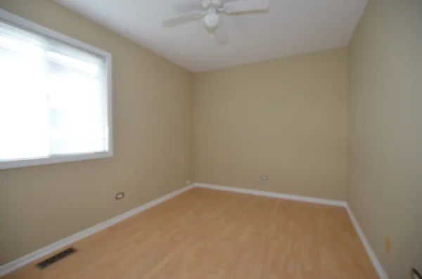 a view of a room that has a window in it