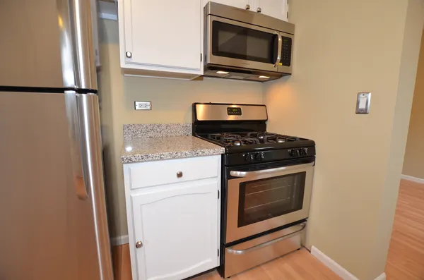 a kitchen with a stove and a microwave