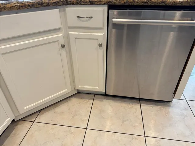 a view of a closet area with an empty room