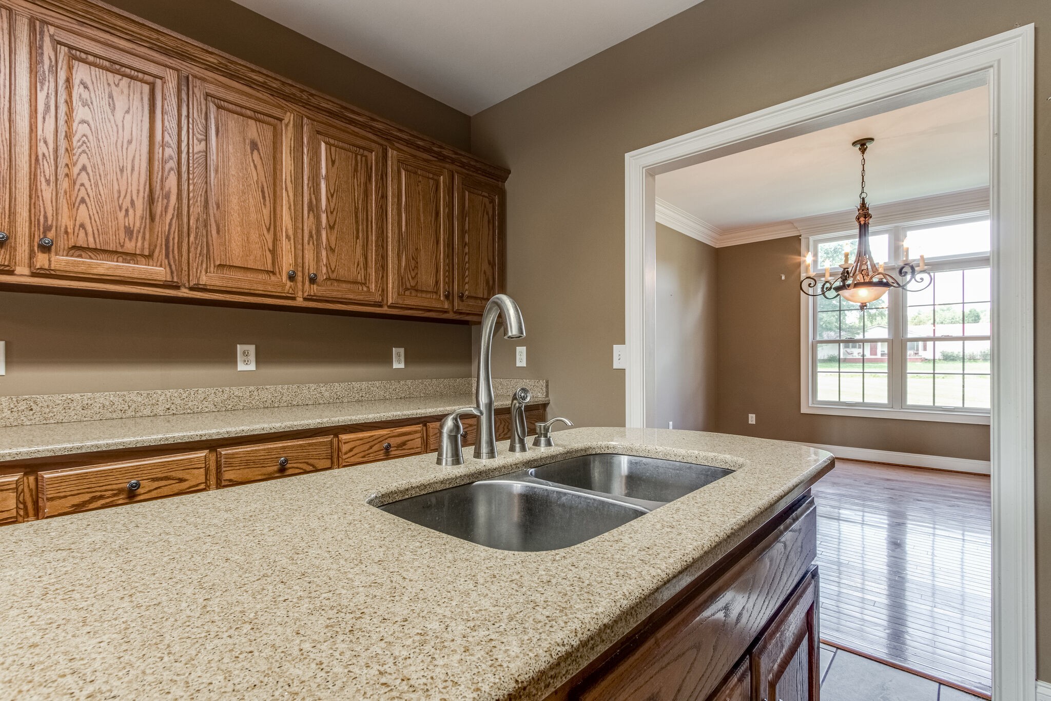 1169 Shedd Road Manchester, TN 37355 - Photo 11 of 36 a kitchen with granite countertop a sink and a window