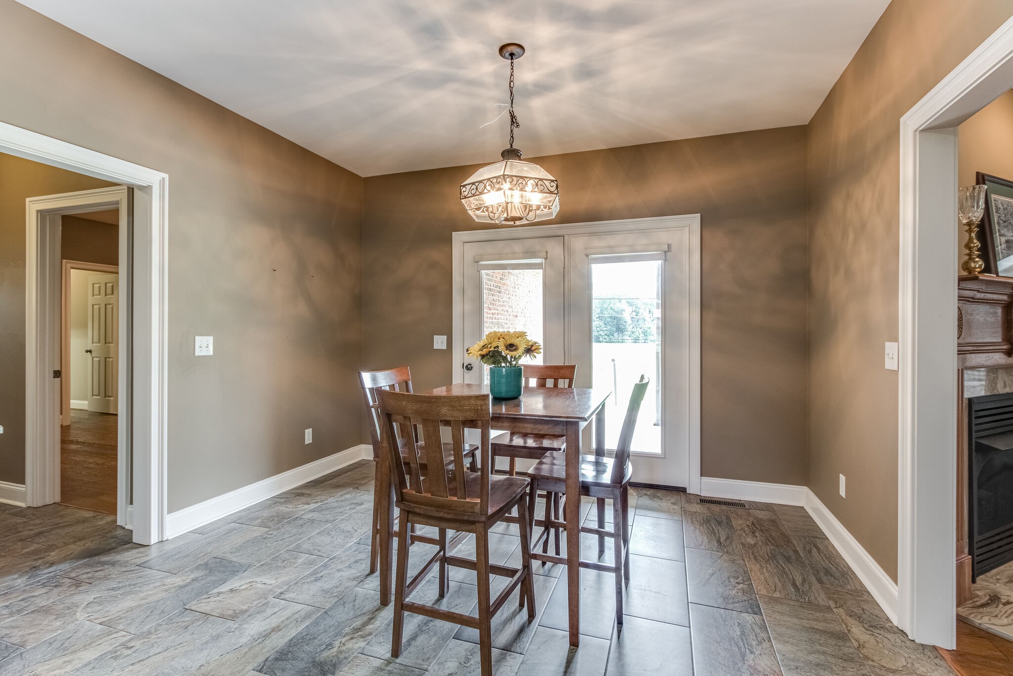1169 Shedd Road Manchester, TN 37355 - Photo 12 of 36 a view of a dining room with furniture window and wooden floor