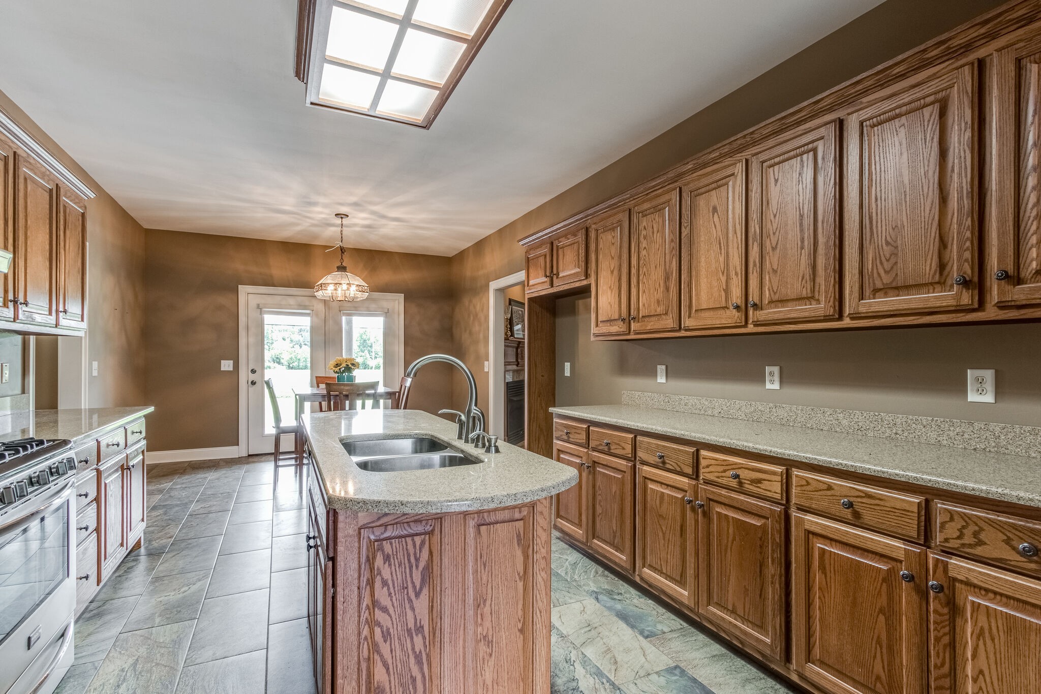 1169 Shedd Road Manchester, TN 37355 - Photo 9 of 36 a kitchen with stainless steel appliances granite countertop a sink dishwasher stove and cabinets with wooden floor