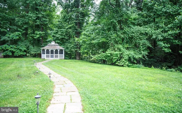 a view of a house and a yard