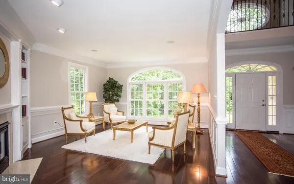 a view of a livingroom with furniture window and wooden floor