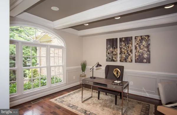 a work room with furniture and a window