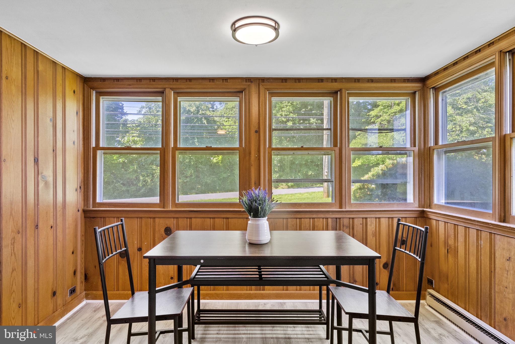 539 Old Meetze Road Warrenton, VA 20186 - Photo 9 of 30 a dining room with furniture a chandelier and wooden floor