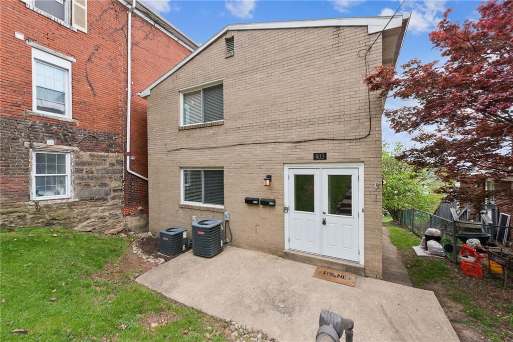403 Homewood Avenue Trafford, PA 15085 - Photo 1 of 30 a view of a house with backyard and garden