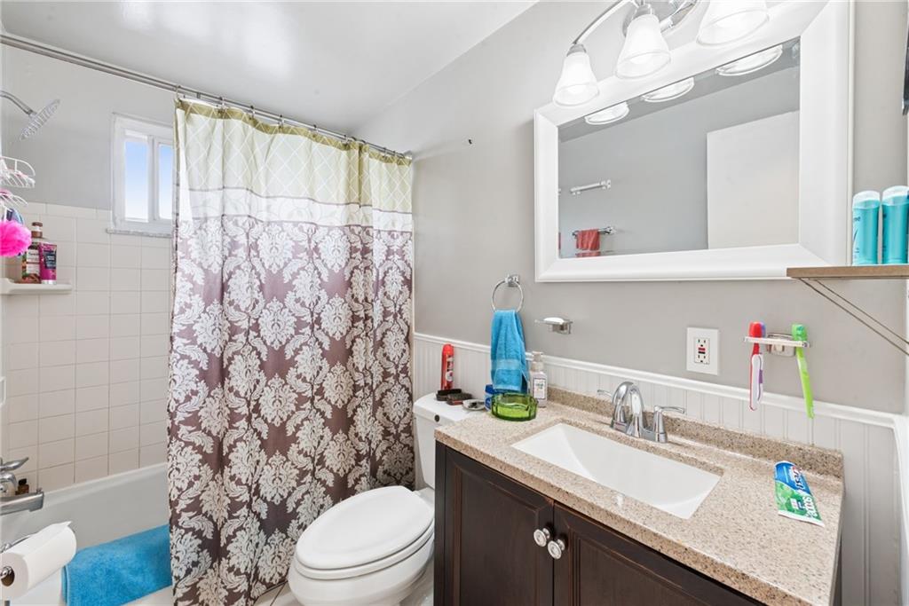 403 Homewood Avenue Trafford, PA 15085 - Photo 18 of 30 a bathroom with a sink vanity mirror and toilet