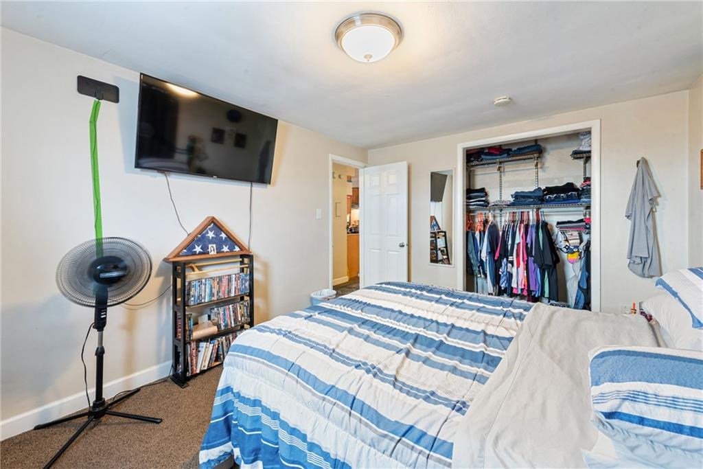 403 Homewood Avenue Trafford, PA 15085 - Photo 20 of 30 a bedroom with a bed and a flat screen tv