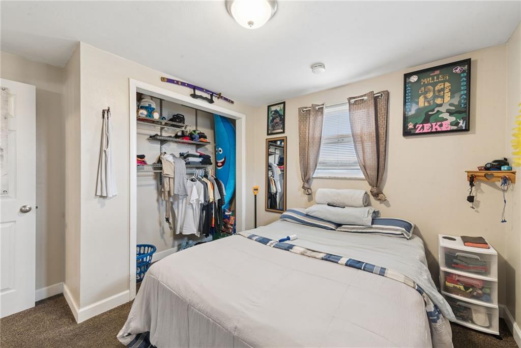 403 Homewood Avenue Trafford, PA 15085 - Photo 22 of 30 a bedroom with a bed and a window