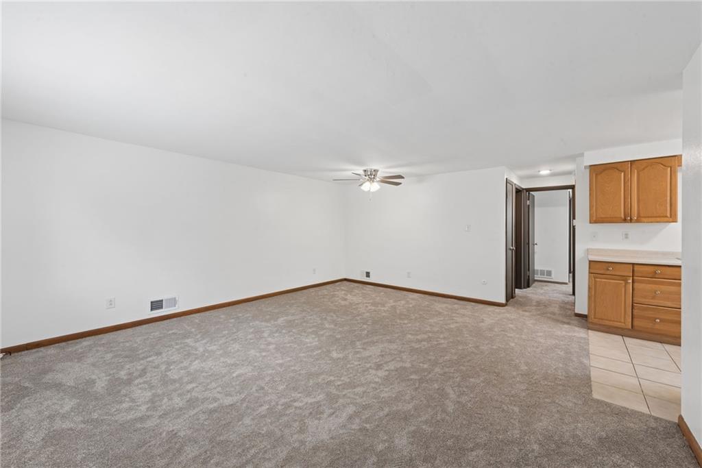 403 Homewood Avenue Trafford, PA 15085 - Photo 5 of 30 an empty room with a empty space and windows