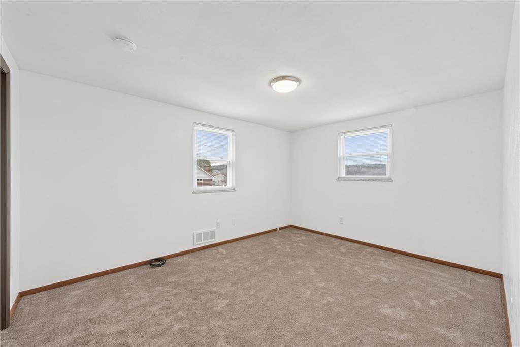 403 Homewood Avenue Trafford, PA 15085 - Photo 8 of 30 an empty room with a window