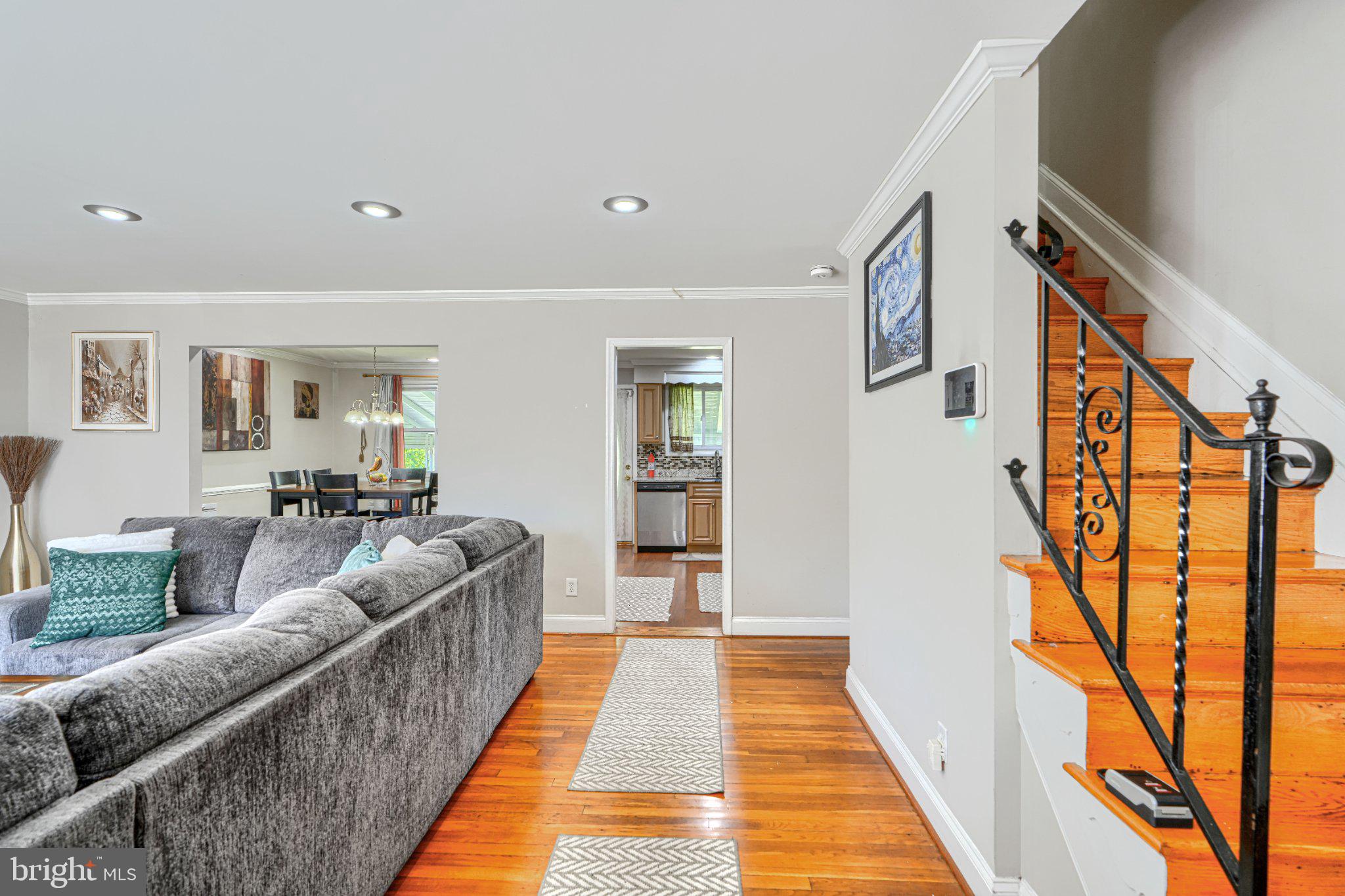 3708 Cassen Road Randallstown, MD 21133 - Photo 3 of 38 a hallway with wooden floor and furniture