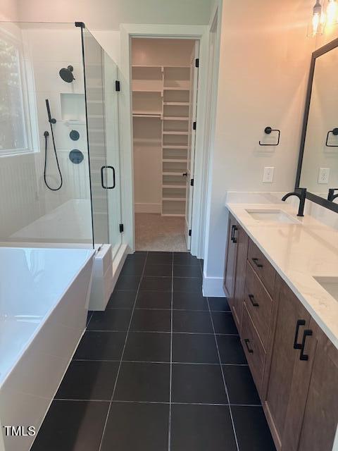 9000 Penny Road Raleigh, NC 27606 - Photo 12 of 32 a bathroom with a double vanity sink a mirror and a bathtub
