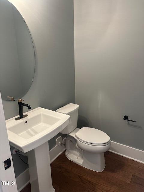 9000 Penny Road Raleigh, NC 27606 - Photo 7 of 32 a bathroom with a sink and a toilet