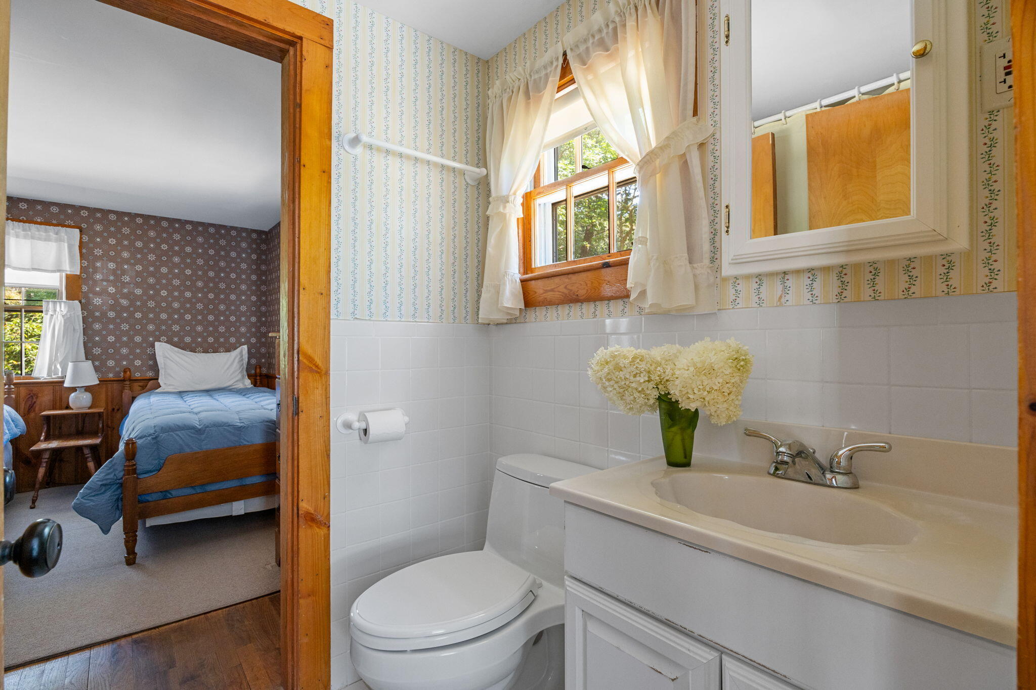 141 Marsh View Road Chatham, MA 02633 - Photo 15 of 24 a bathroom with a sink a toilet and a mirror