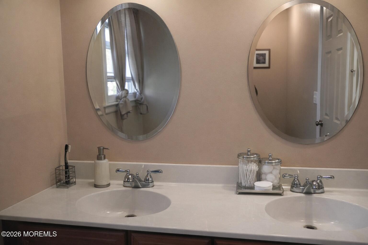 4 Westbrook Road Howell, NJ 07731 - Photo 12 of 18 a bathroom with double vanity sinks and a mirror